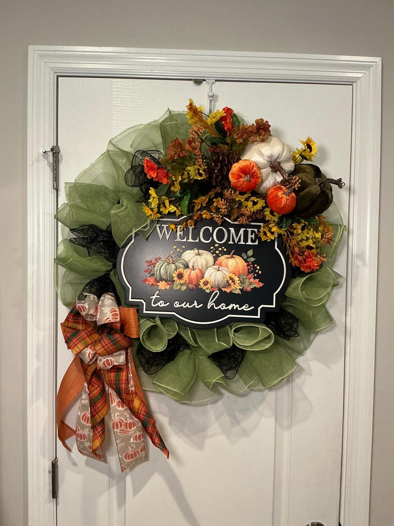 Actual front photograph of sunflower pumpkin fall welcome wreath