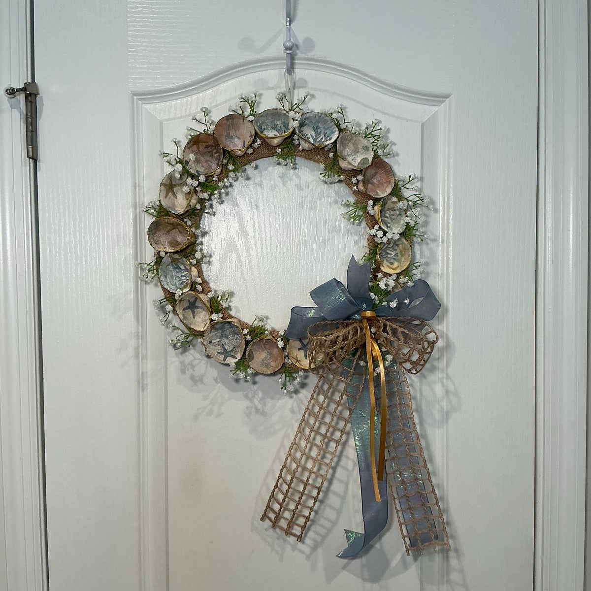 14 Inch Coastal Seashell Wreath with Starfish and Burlap on Metal Frame
