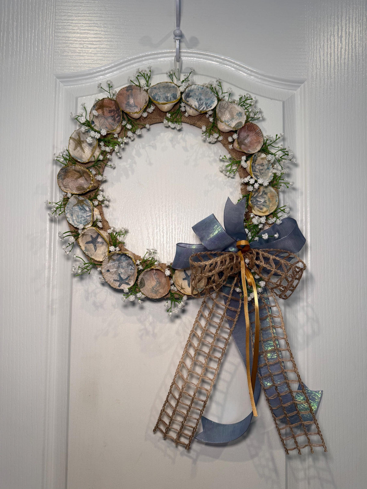 14 Inch Coastal Seashell Wreath with Starfish and Burlap on Metal Frame