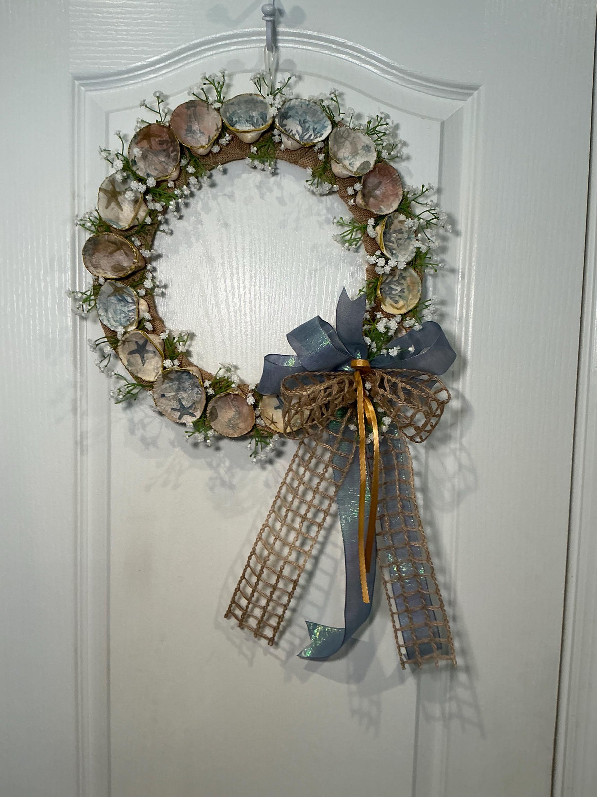 14 Inch Coastal Seashell Wreath with Starfish and Burlap on Metal Frame