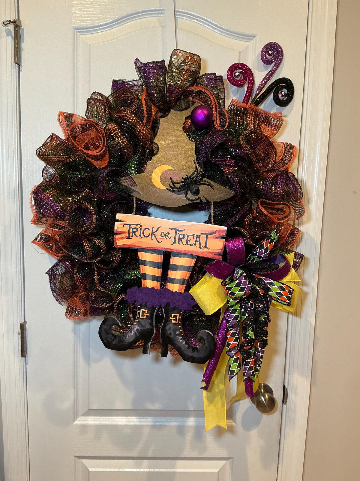 Halloween Witch Wreath, 18 Inch Trick or Treat Sign with Hat, Boots and Spider — actual product photo