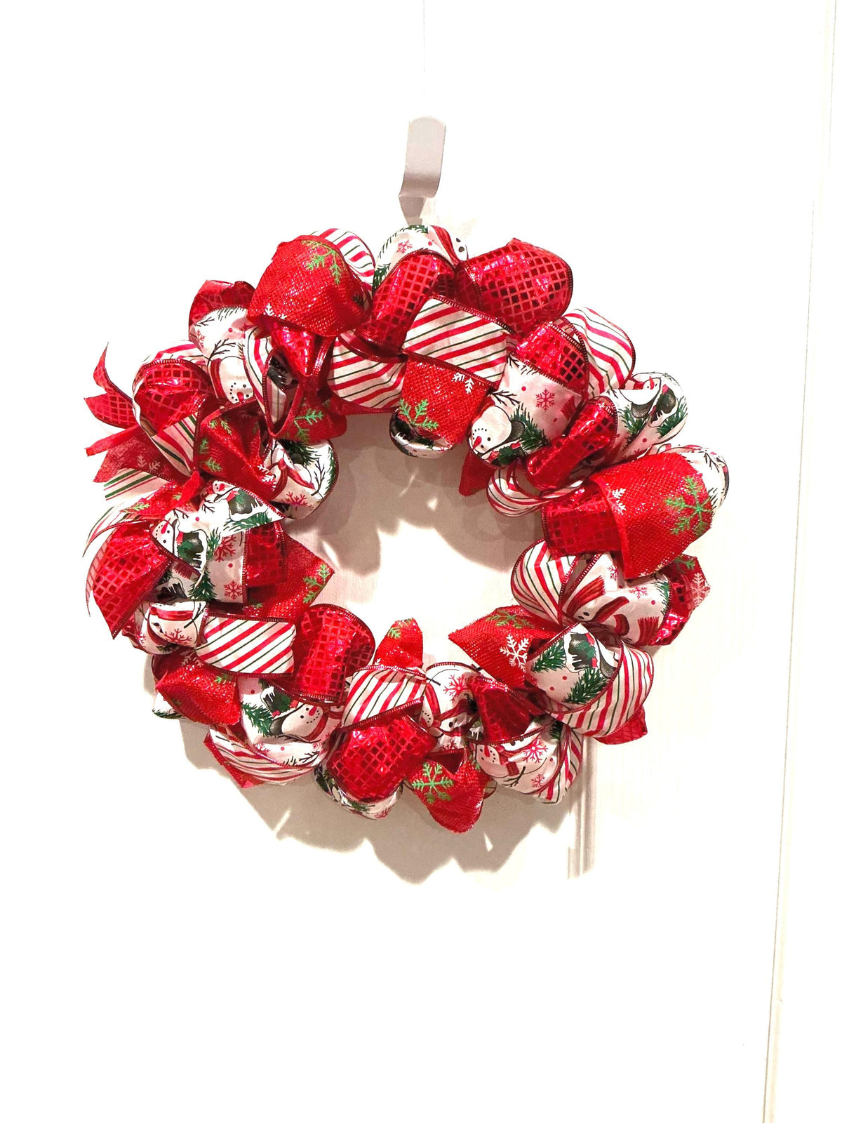 12 Inch Snowman Christmas Wreath: Red White Candy Cane Ribbon Door Decor — actual product photo