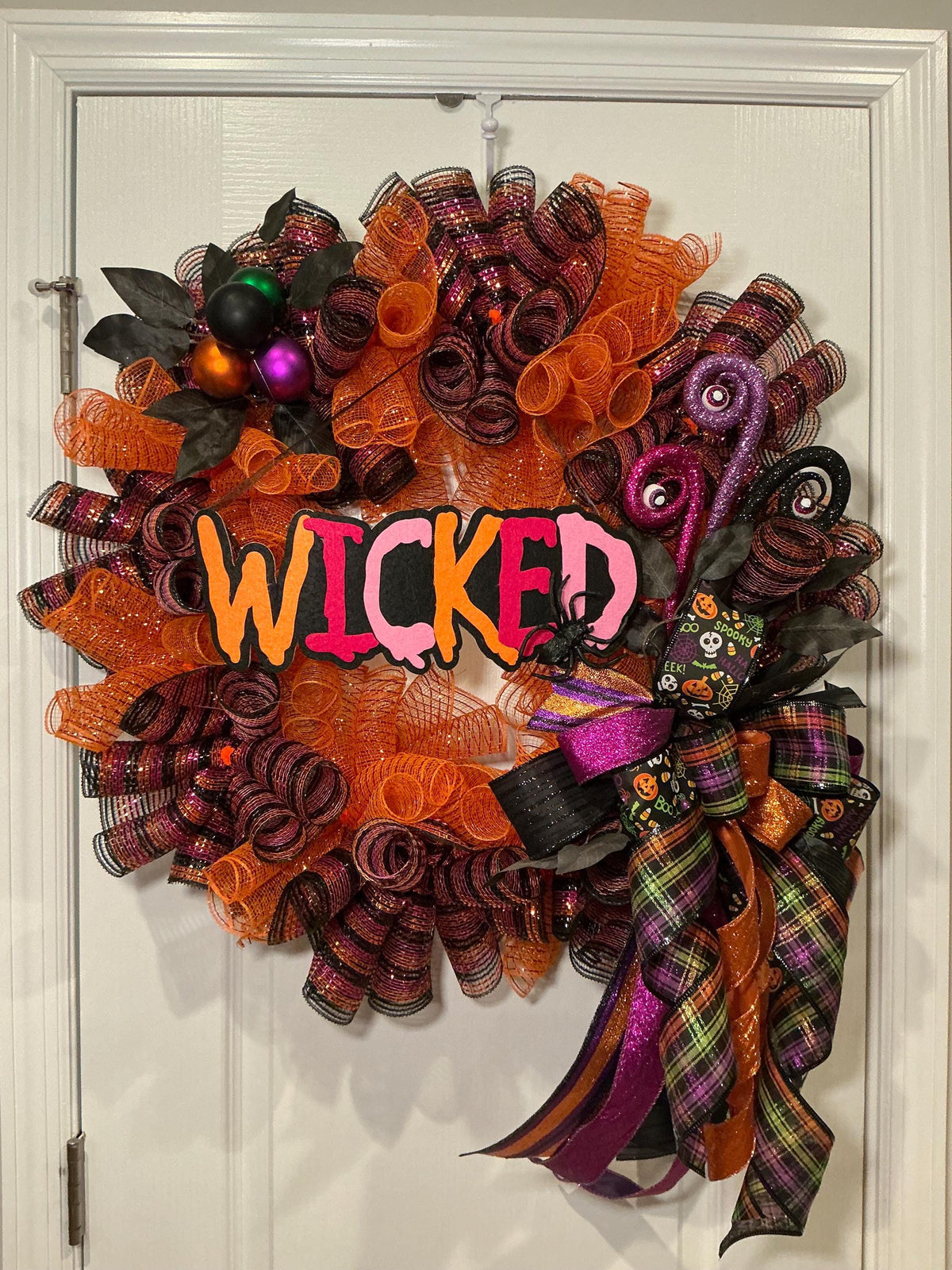 Wicked Halloween Wreath, 18 Inch Orange Purple Deco Curl Door Decor with Spider Bow — actual product photo