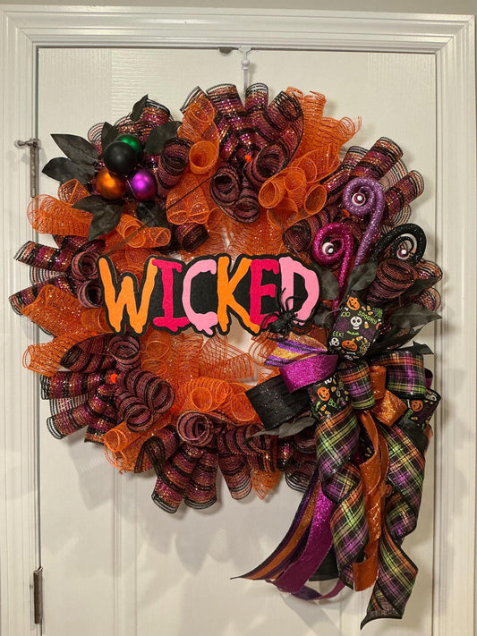 Wicked Halloween Wreath, 18 Inch Orange Purple Deco Curl Door Decor with Spider Bow — actual product photo