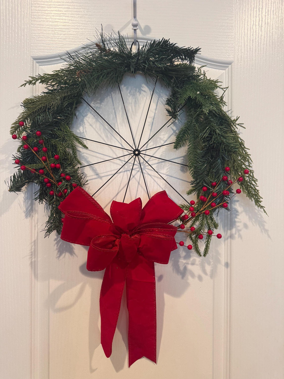 Handmade Christmas Wreath, Spoke Wheel, Pine Cedar, Red Berries, Red Bow Front Door Decor — actual product photo