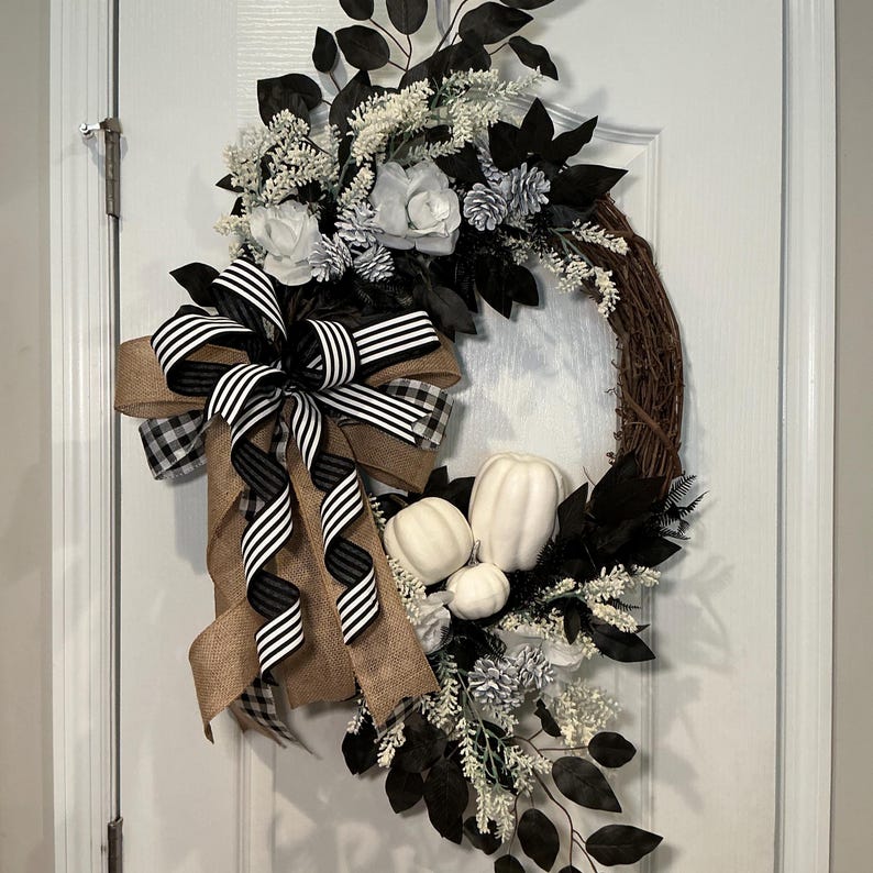 Actual front photograph of black and white pumpkin grapevine wreath