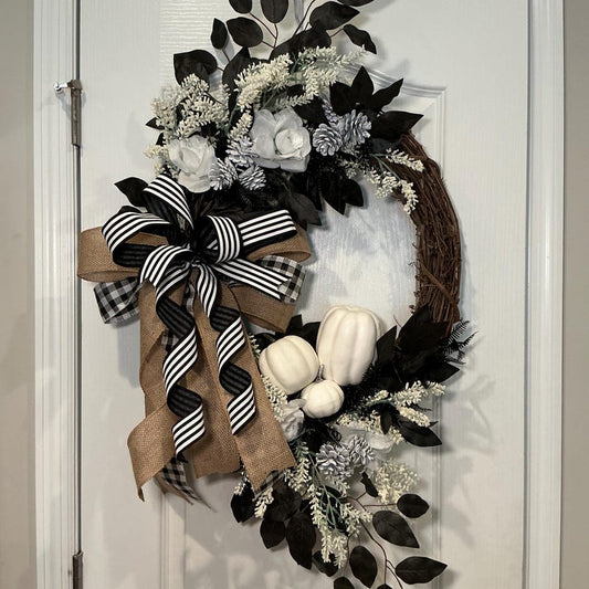 Actual front photograph of black and white pumpkin grapevine wreath