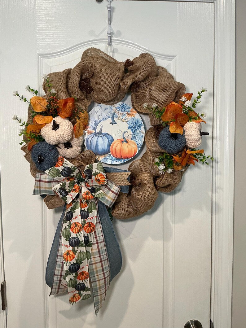 Actual front photograph of the blue and white crochet pumpkin wreath