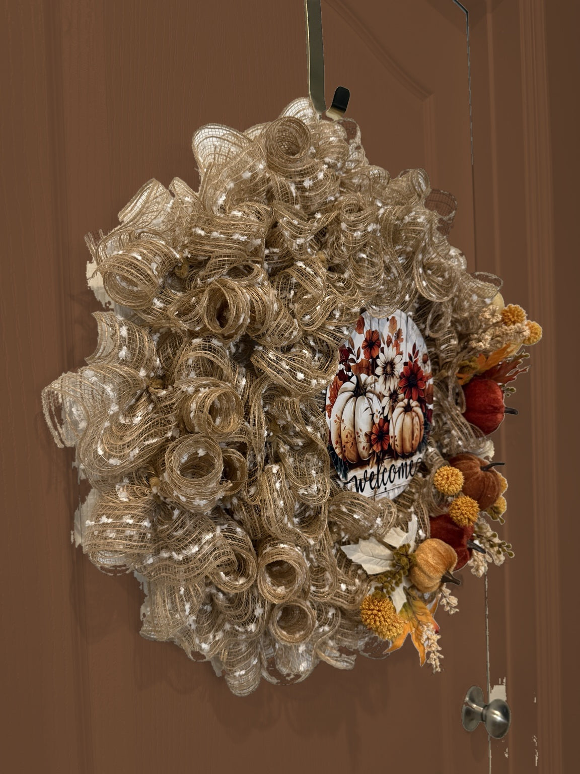 Welcome to Fall wreath on brown door, side view