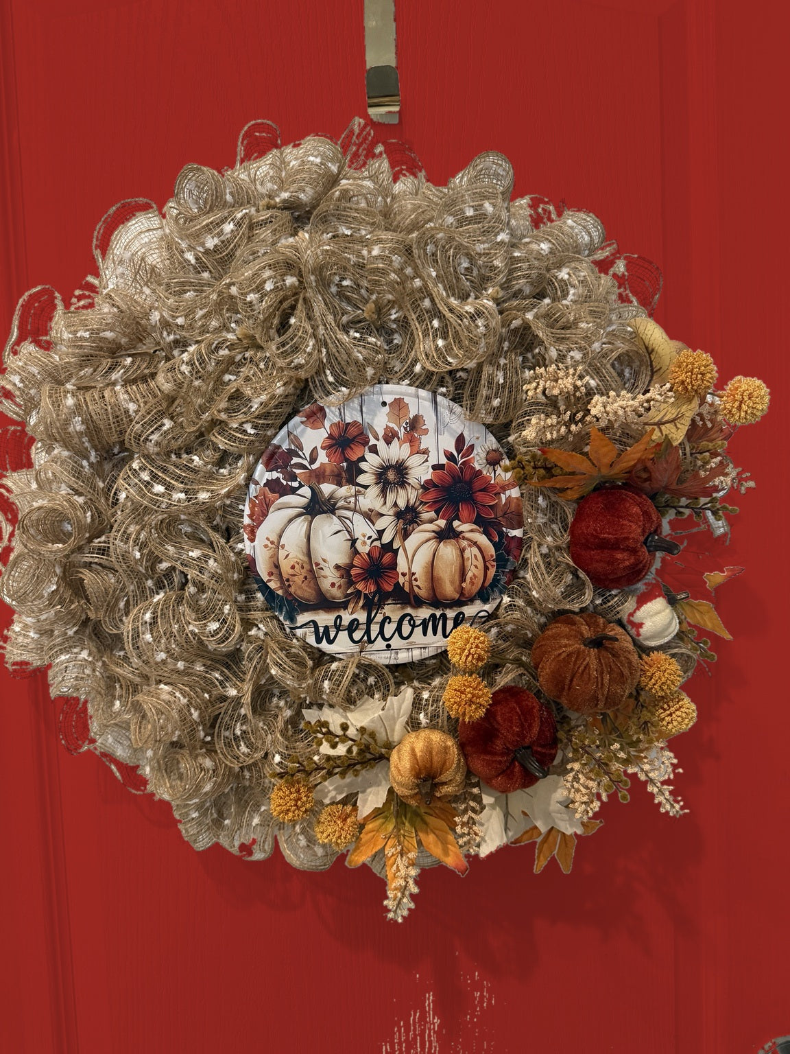 Welcome to Fall wreath on red door, front view