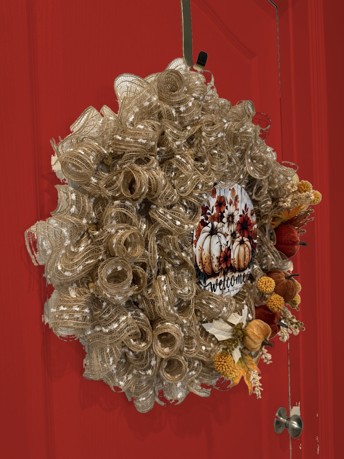Welcome to Fall wreath on red door, side view