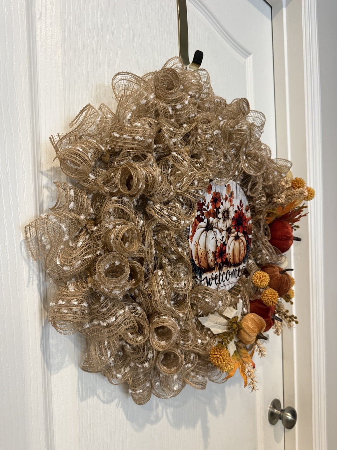 Welcome to Fall wreath on white door, side view